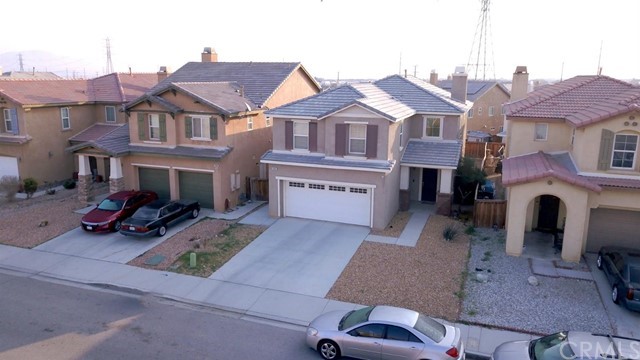 15087 Diamond Road Victorville, CA 92394 - Photo 1 of 1 a view of multiple houses with a yard