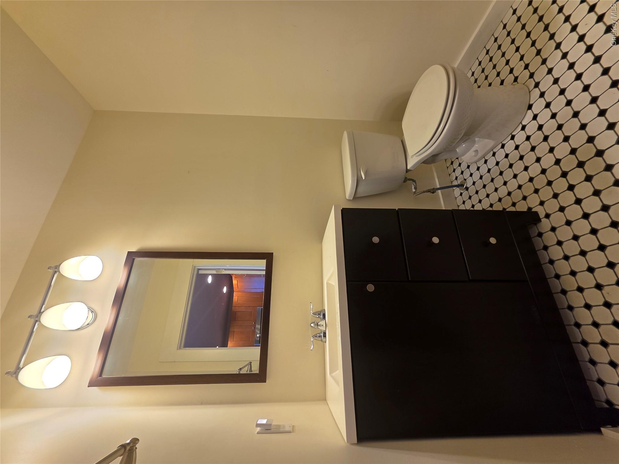231 Reynolds Road, Unit 11 Loch Sheldrake, NY 12759 - Photo 14 of 20 2nd flr Bathroom featuring toilet, vanity, and baseboards