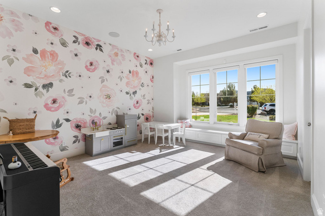 2917 Old Farm Road Washington, UT 84780 - Photo 55 of 105 Recreation room featuring wallpapered walls, hanging lights, light colored carpet, and an accent wall