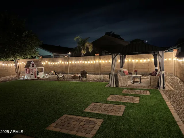 a view of a back yard of the house