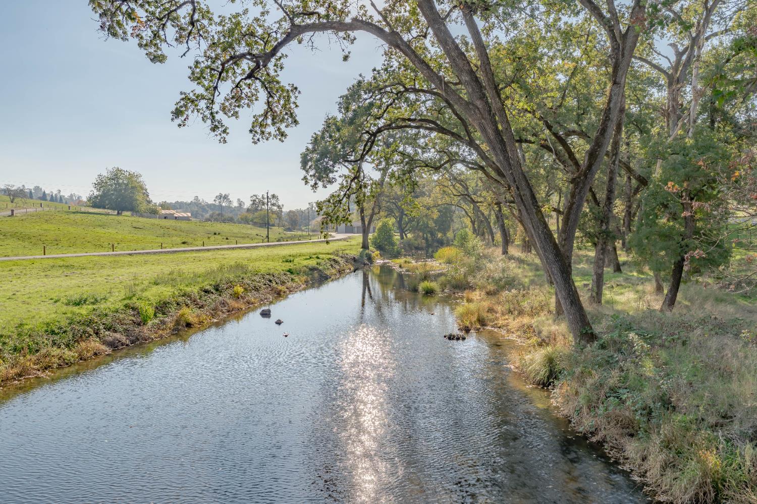 5585 Garden Bar Road Lincoln, CA 95648 - Photo 8 of 25 a view of a lake with houses in the back