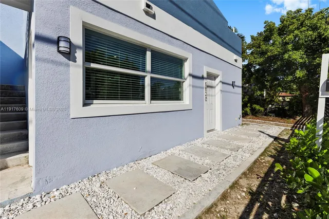 a view of a backyard of a house