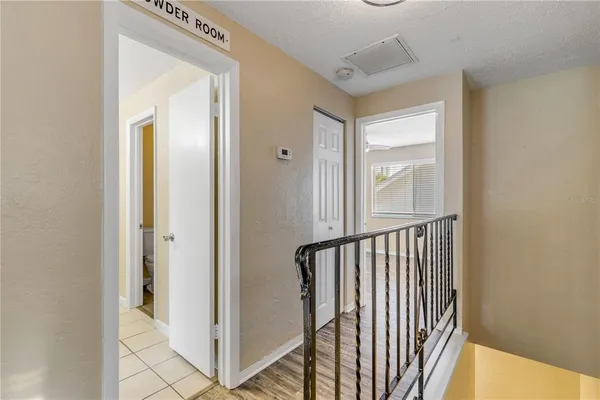 a view of an empty room and wooden floor