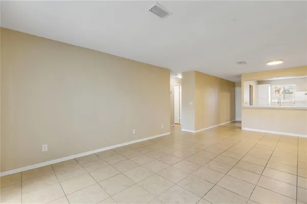 a view of an empty room and a window