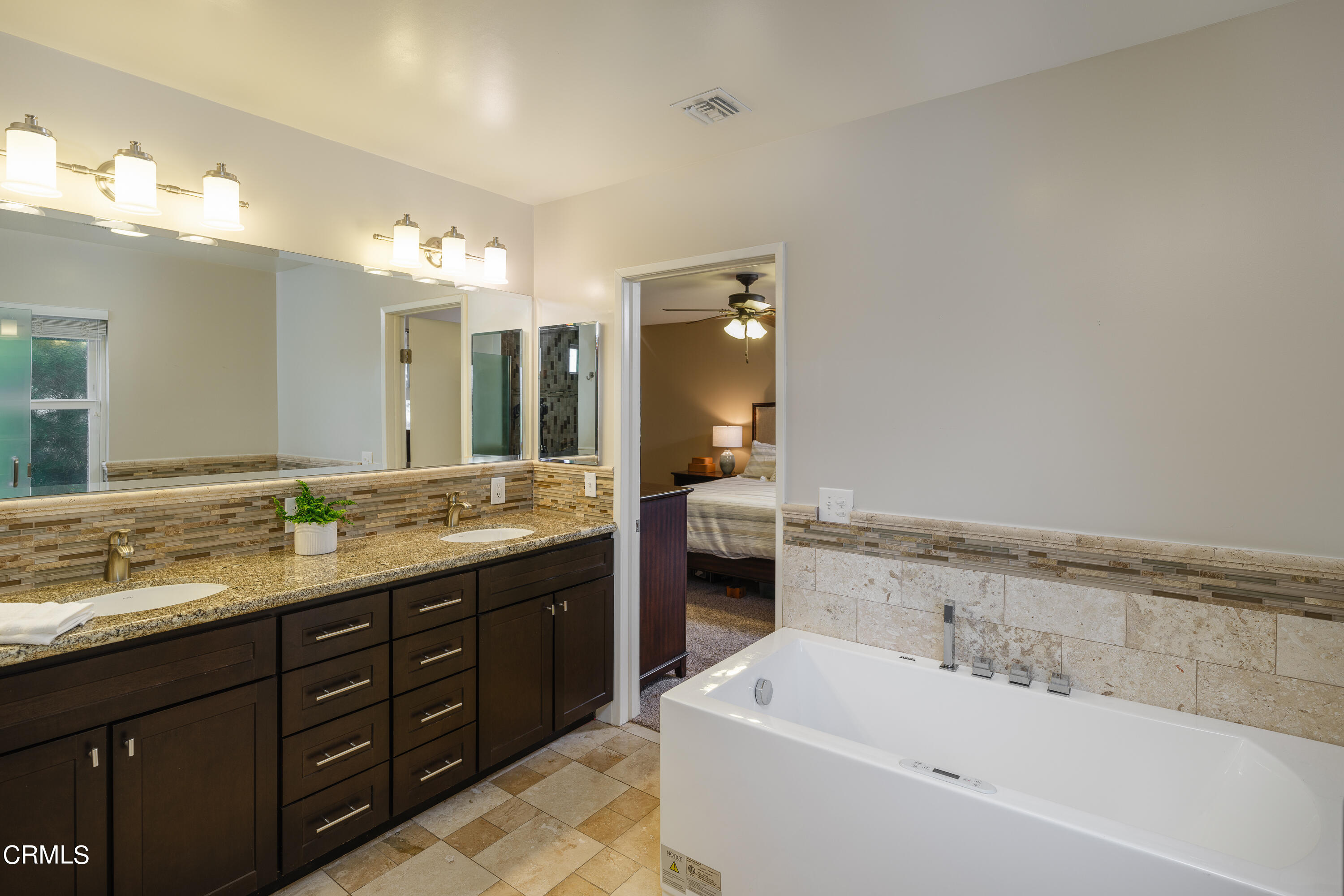 4344 El Prieto Road Altadena, CA 91001 - Photo 17 of 31 a bathroom with a tub a double vanity sink and mirror