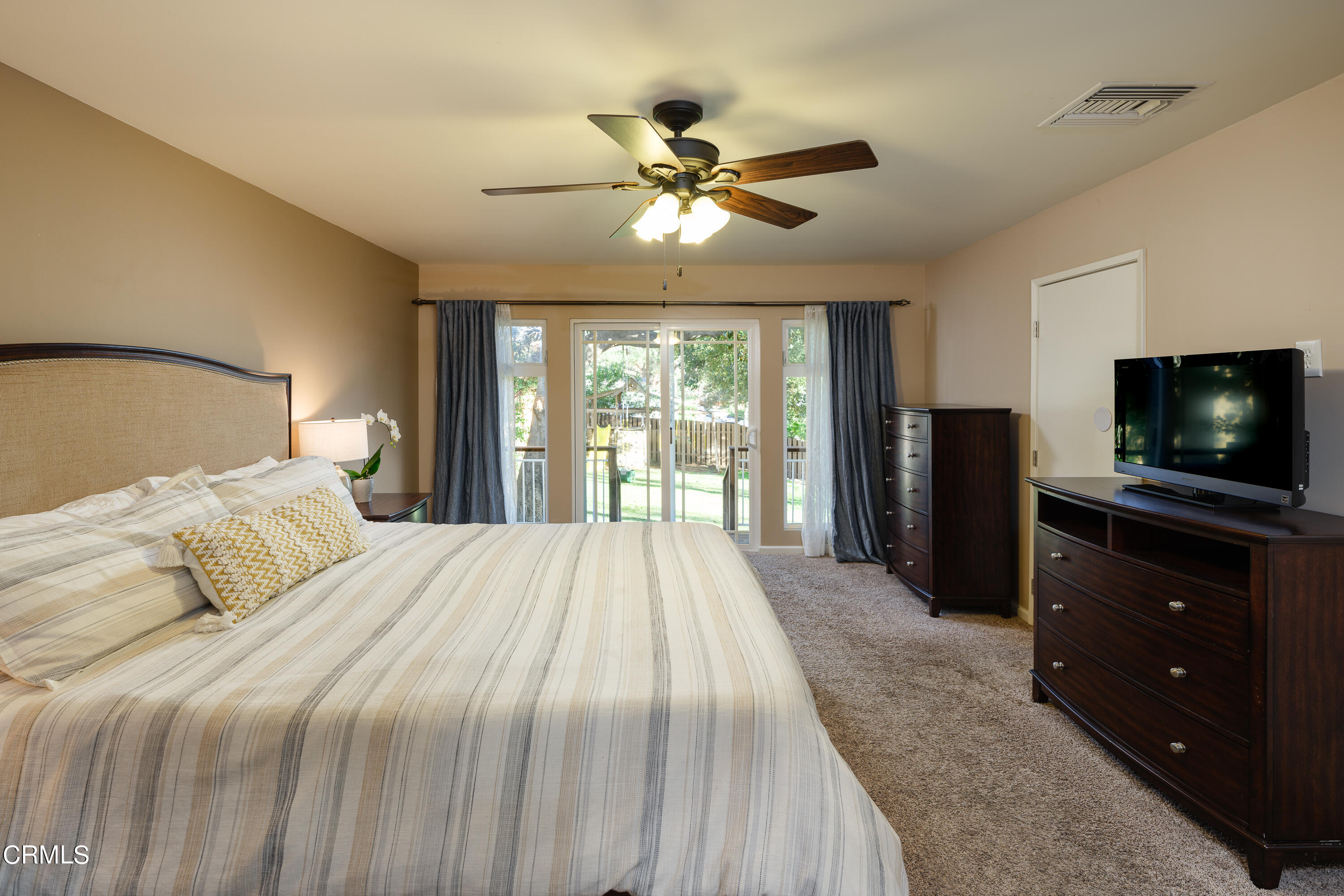 4344 El Prieto Road Altadena, CA 91001 - Photo 21 of 31 a bedroom with a bed and a flat screen tv
