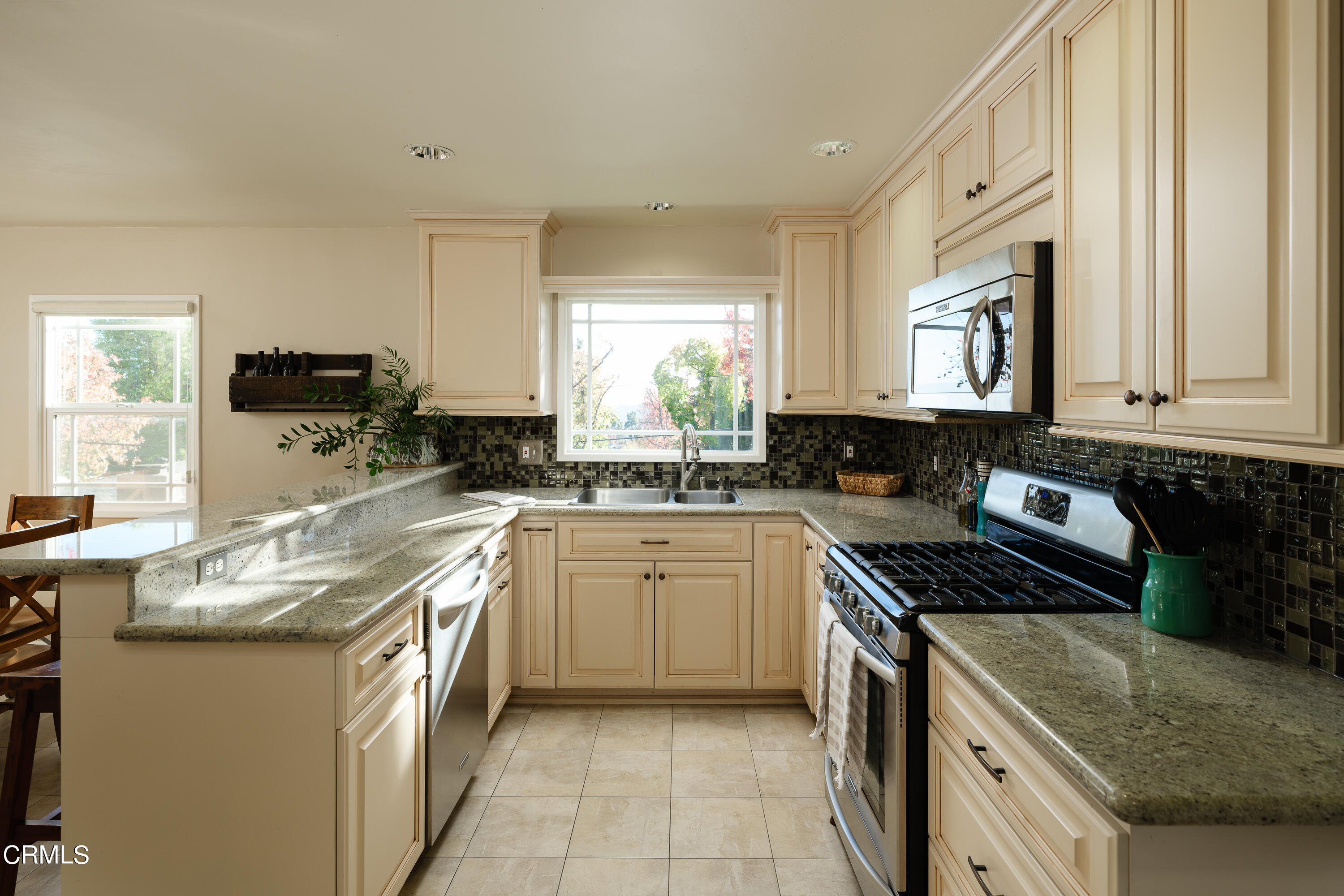 4344 El Prieto Road Altadena, CA 91001 - Photo 8 of 31 a kitchen with stainless steel appliances granite countertop a stove a sink and a microwave