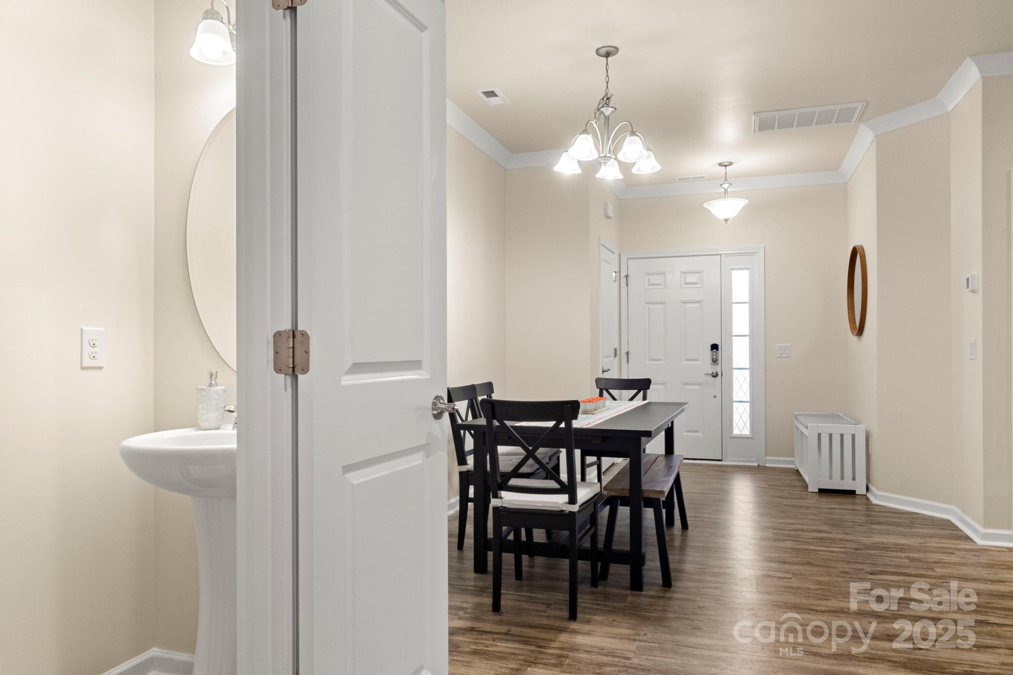 525 Hunters Dance Road Fort Mill, SC 29708 - Photo 12 of 28 a view of a dining room with furniture and wooden floor