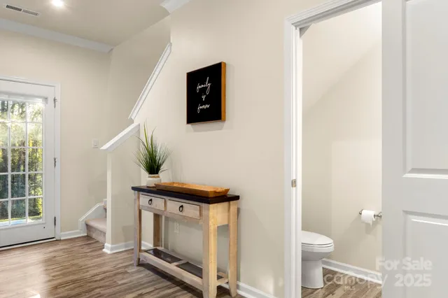 a living room with furniture and a toilet