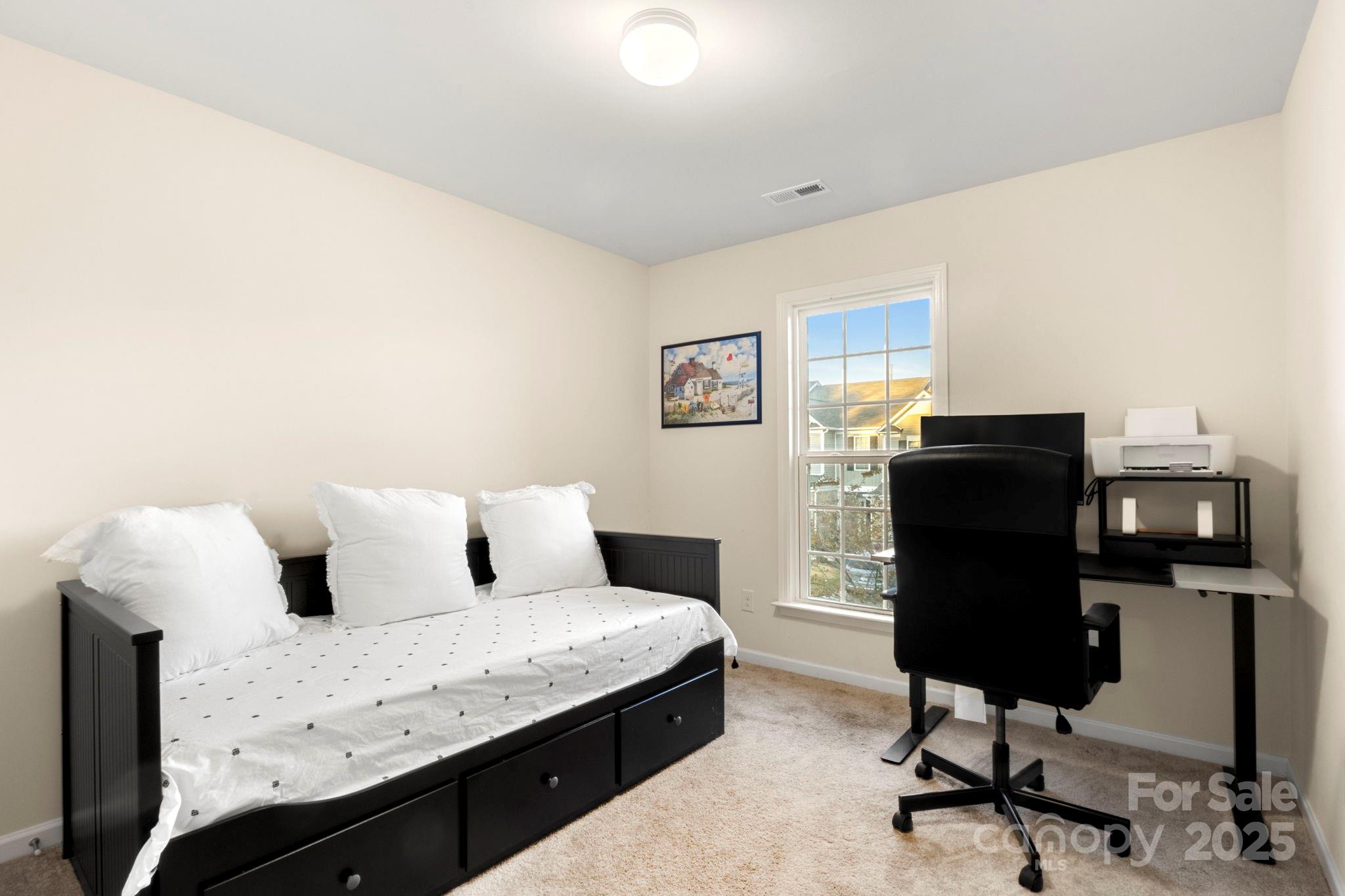 525 Hunters Dance Road Fort Mill, SC 29708 - Photo 20 of 28 a bedroom with a bed and a desk