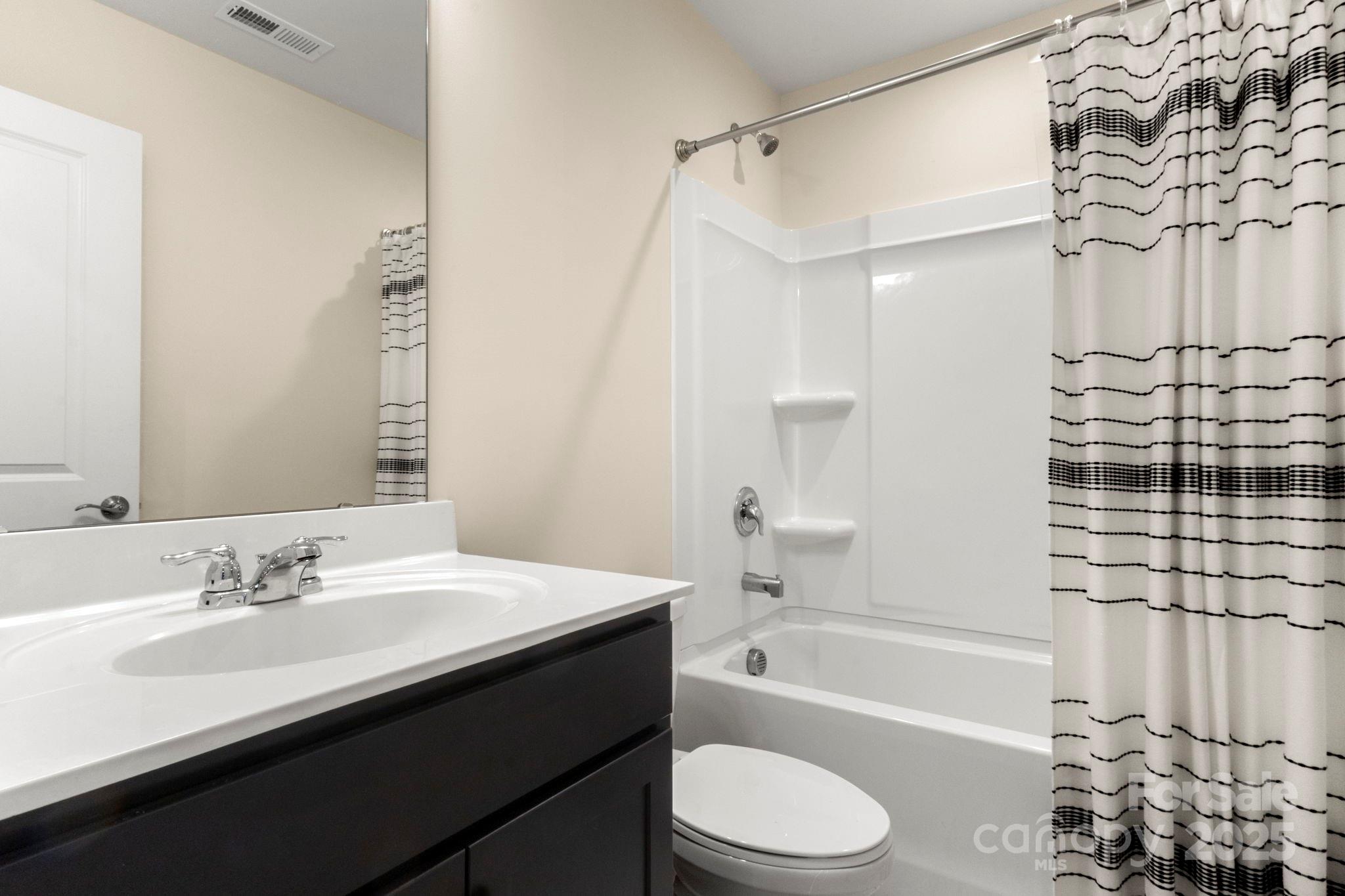 525 Hunters Dance Road Fort Mill, SC 29708 - Photo 21 of 28 a bathroom with a sink a toilet and shower