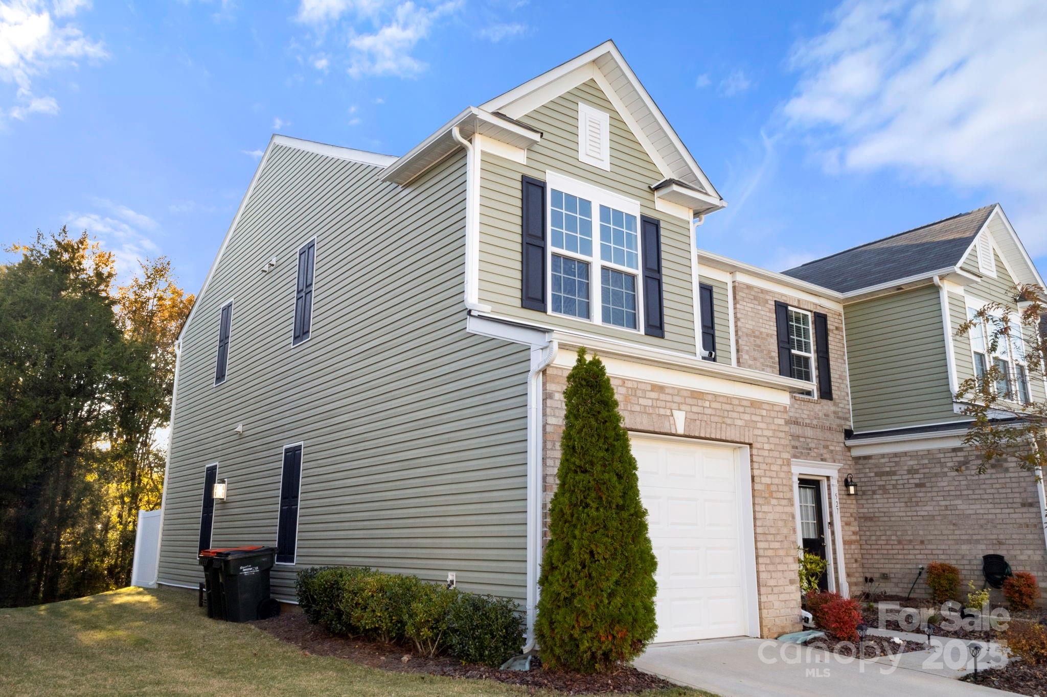 525 Hunters Dance Road Fort Mill, SC 29708 - Photo 26 of 28 a front view of a house with a yard