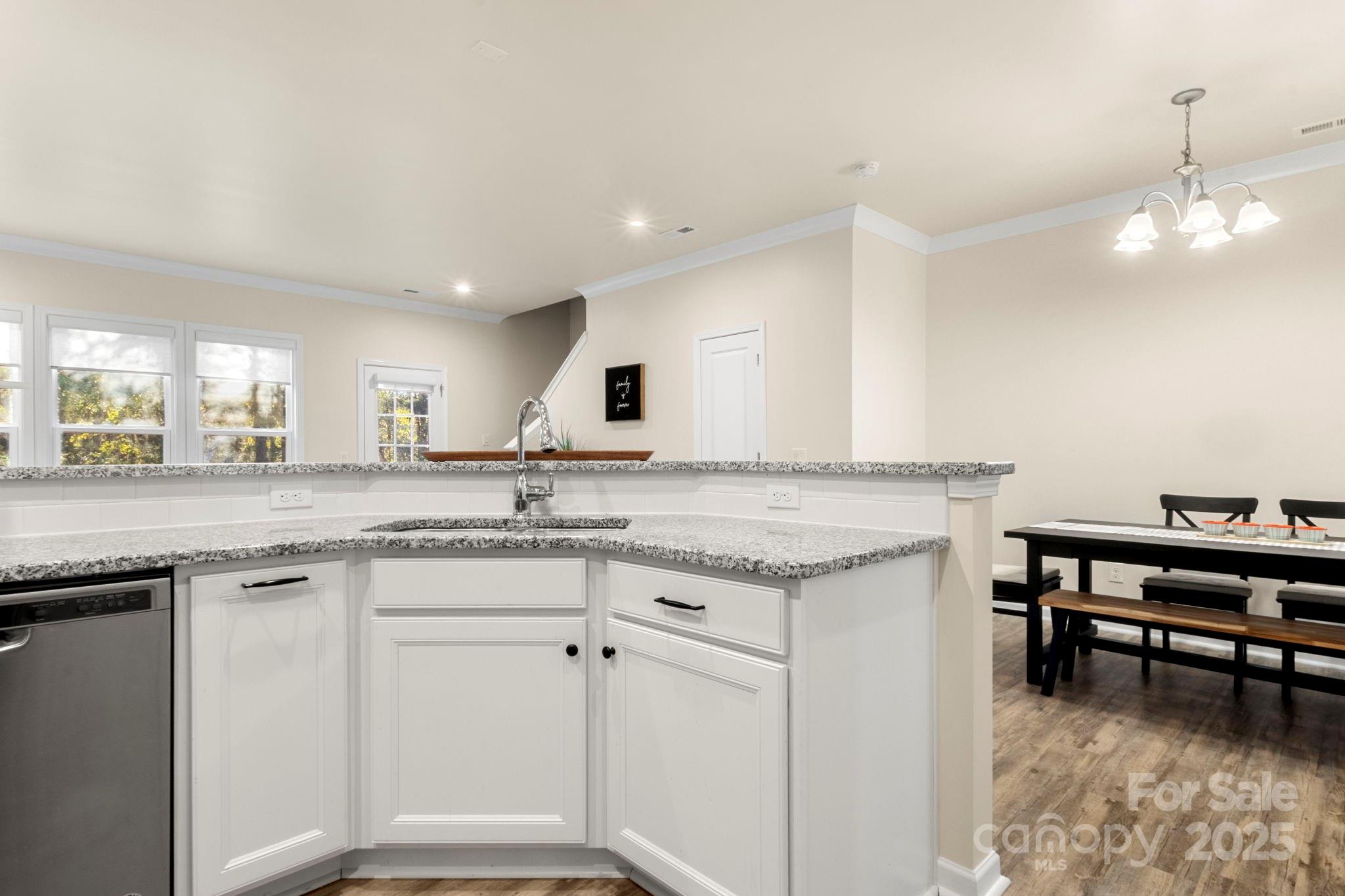 525 Hunters Dance Road Fort Mill, SC 29708 - Photo 6 of 28 a kitchen with granite countertop white cabinets and appliances