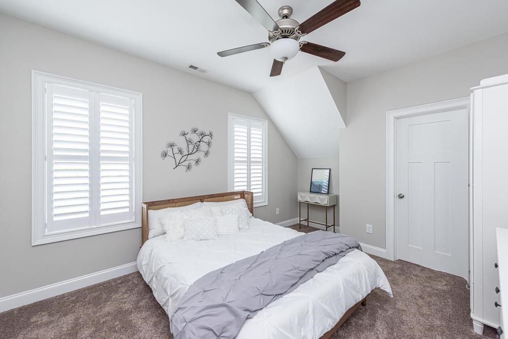 714 Edmund Street Raleigh, NC 27604 - Photo 18 of 30 Bedroom 2 with double windows and ceiling fan.