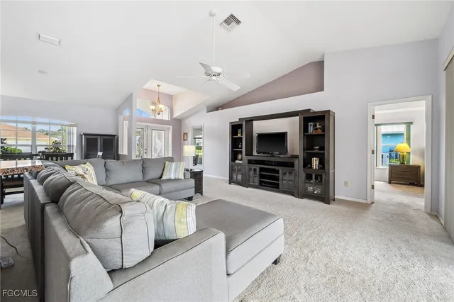 a view of a dining room with furniture and a window