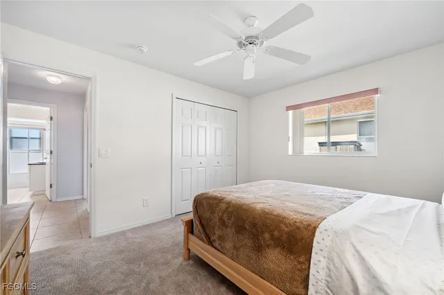 a bathroom with a granite countertop sink toilet a mirror and shower