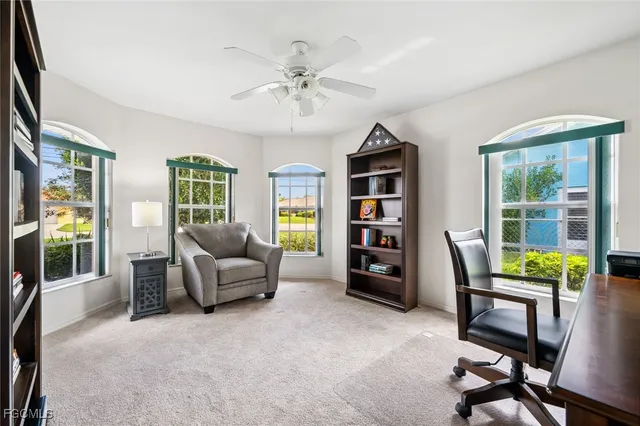 a view of a workspace with furniture