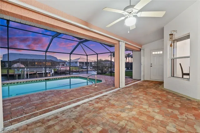 a view of a swimming pool with sitting area