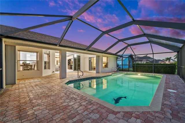 a view of a backyard with swimming pool