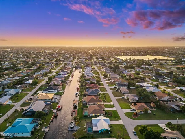 an aerial view of residential houses with city view