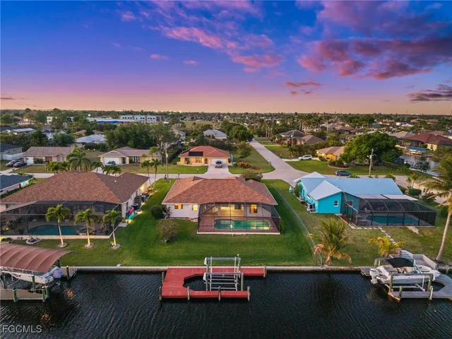 a kitchen with granite countertop cabinets stainless steel appliances a sink and a counter top space