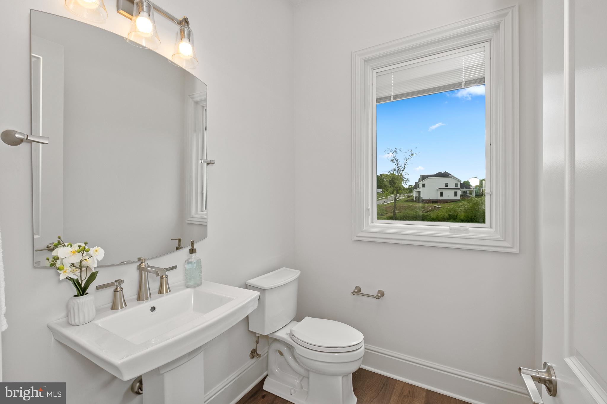 510 Newcomen Road, Unit R1D Exton, PA 19341 - Photo 21 of 51 a bathroom with a sink mirror and toilet