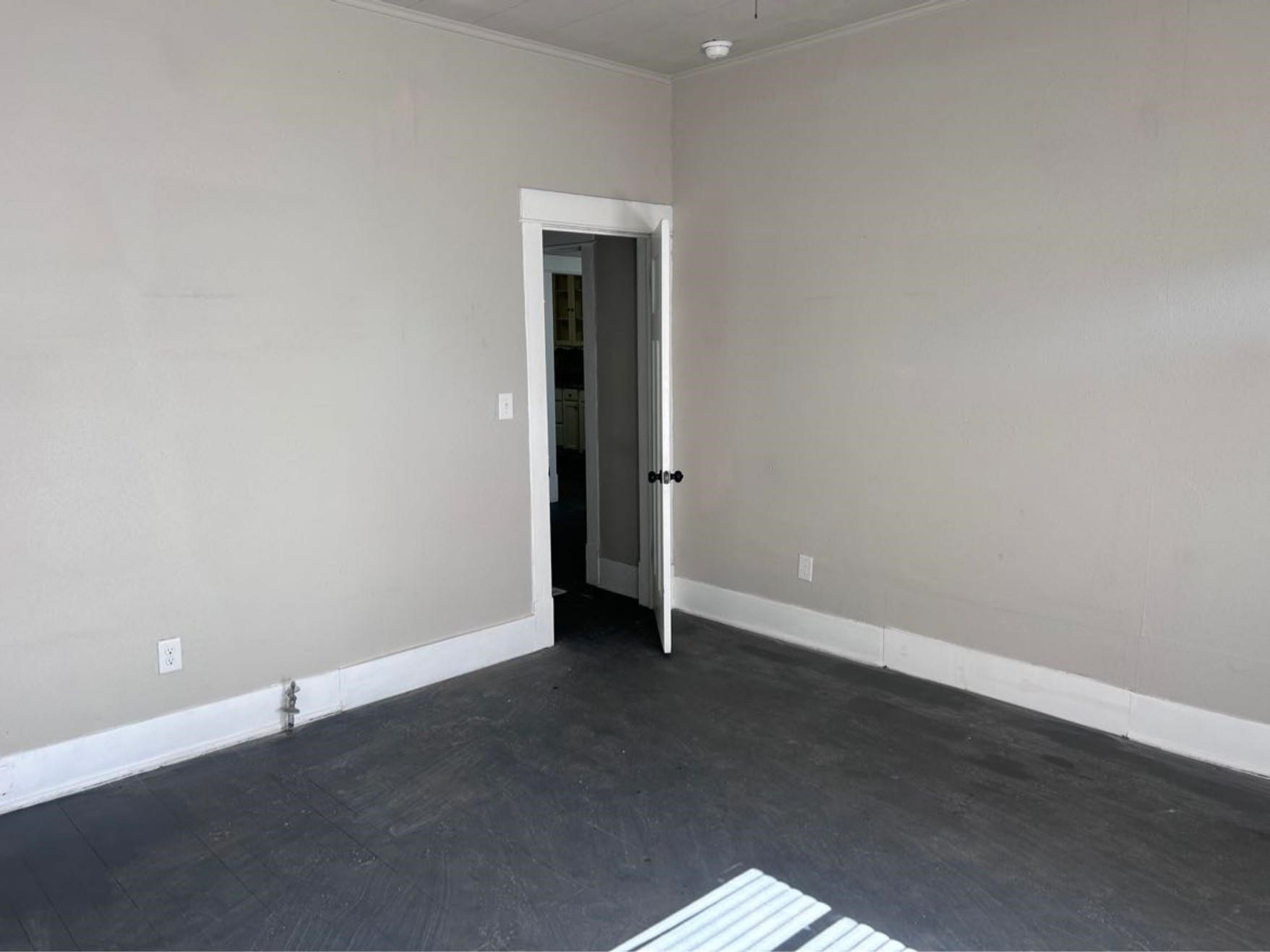 1925 11th Street Port Arthur, TX 77640 - Photo 16 of 28 an empty room with wooden floor and closet