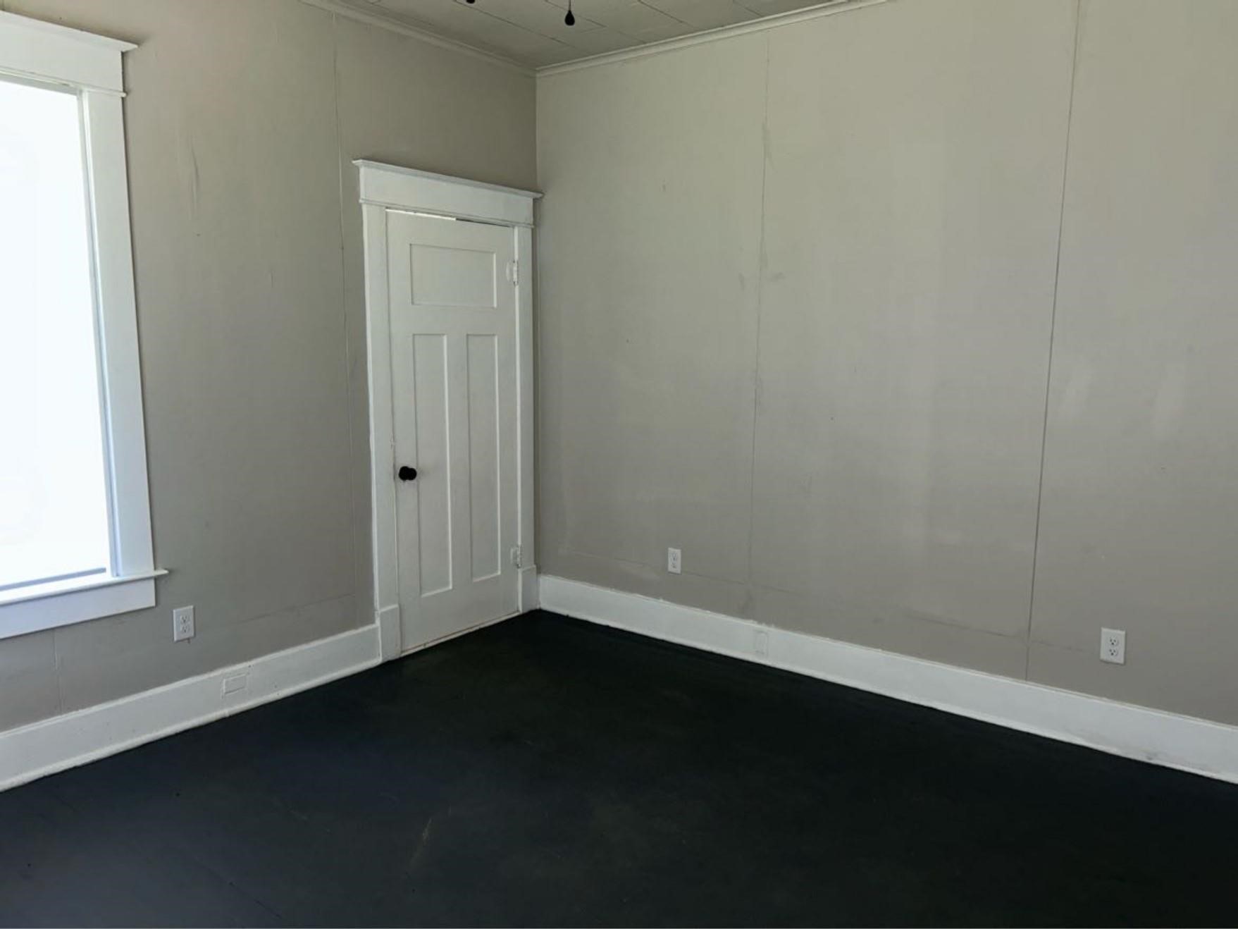 1925 11th Street Port Arthur, TX 77640 - Photo 24 of 28 an empty room with a wooden door