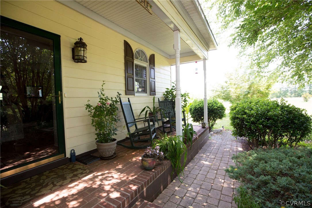 301 Slaughter Road Keysville, VA 23947 - Photo 1 of 50 a view of a back yard of the house and cars parked
