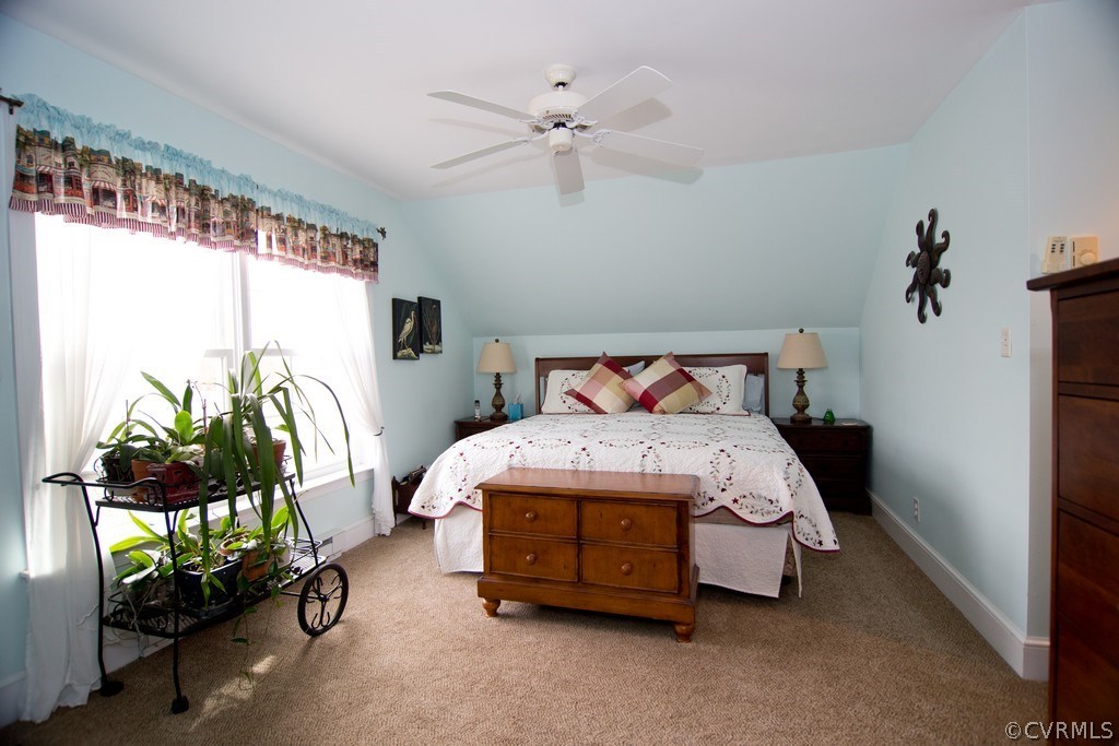 301 Slaughter Road Keysville, VA 23947 - Photo 14 of 50 a bedroom with a bed mirror and window