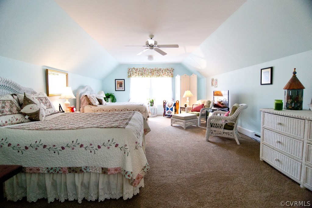301 Slaughter Road Keysville, VA 23947 - Photo 17 of 50 a bed room with a bed mirror and a window