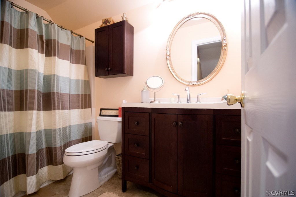 301 Slaughter Road Keysville, VA 23947 - Photo 18 of 50 a bathroom with a sink a toilet and a mirror