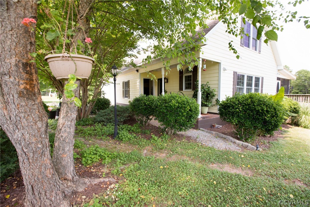 301 Slaughter Road Keysville, VA 23947 - Photo 2 of 50 a front view of a house with a yard and fountain
