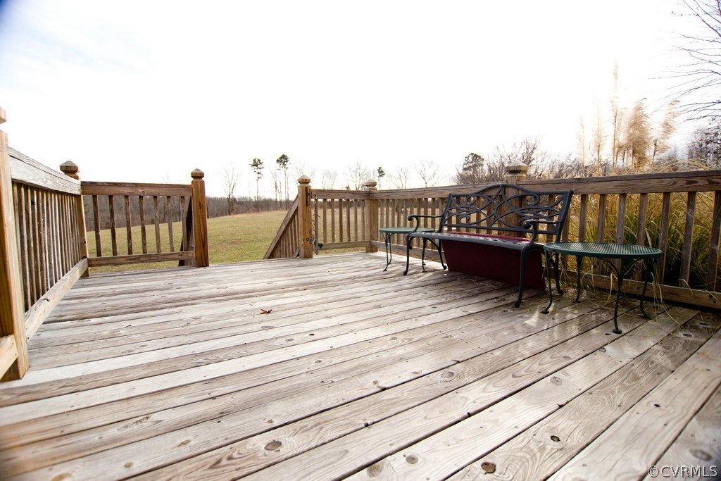 301 Slaughter Road Keysville, VA 23947 - Photo 21 of 50 a balcony with view of wooden floor and fence