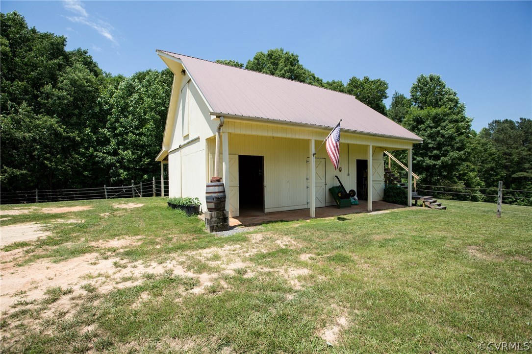 301 Slaughter Road Keysville, VA 23947 - Photo 30 of 50 a view of a house with backyard and garden