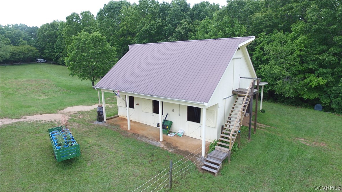 301 Slaughter Road Keysville, VA 23947 - Photo 38 of 50 a aerial view of a house with a yard table and chairs