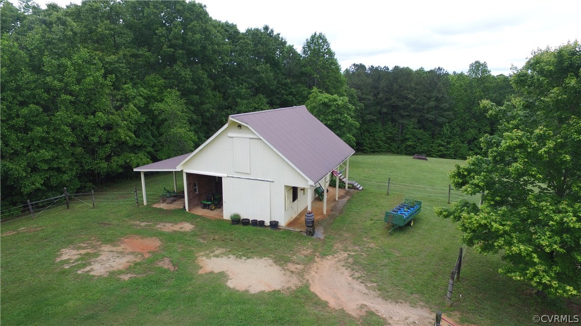 301 Slaughter Road Keysville, VA 23947 - Photo 39 of 50 a view of a backyard with a small cabin