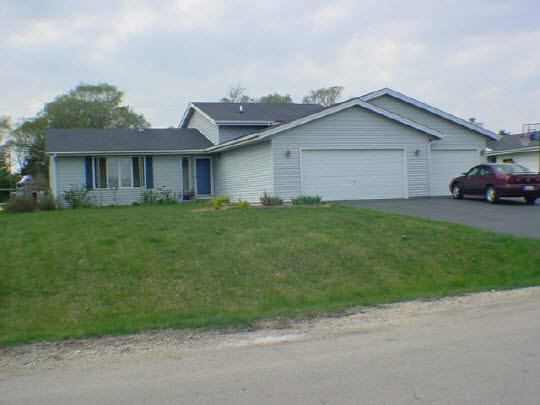 624 Pin Oak Road Rockton, IL 61072 - Photo 1 of 6 a view of a yard in front of a house