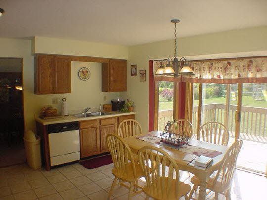 624 Pin Oak Road Rockton, IL 61072 - Photo 2 of 6 a kitchen with stainless steel appliances granite countertop a stove a sink and a wooden floors