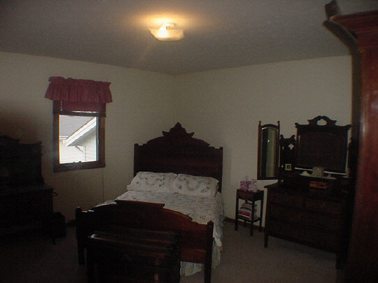 624 Pin Oak Road Rockton, IL 61072 - Photo 4 of 6 a bedroom with a bed and a window
