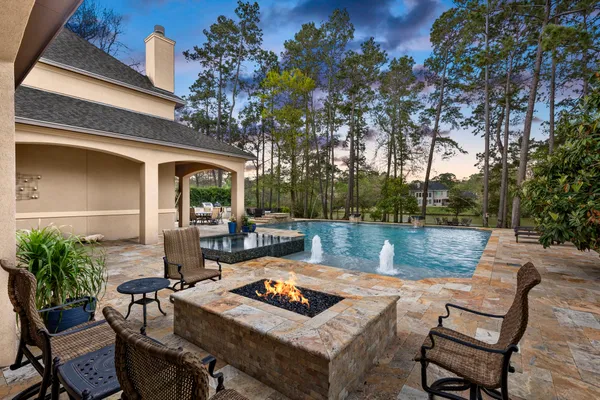 a view of backyard of house with seating space