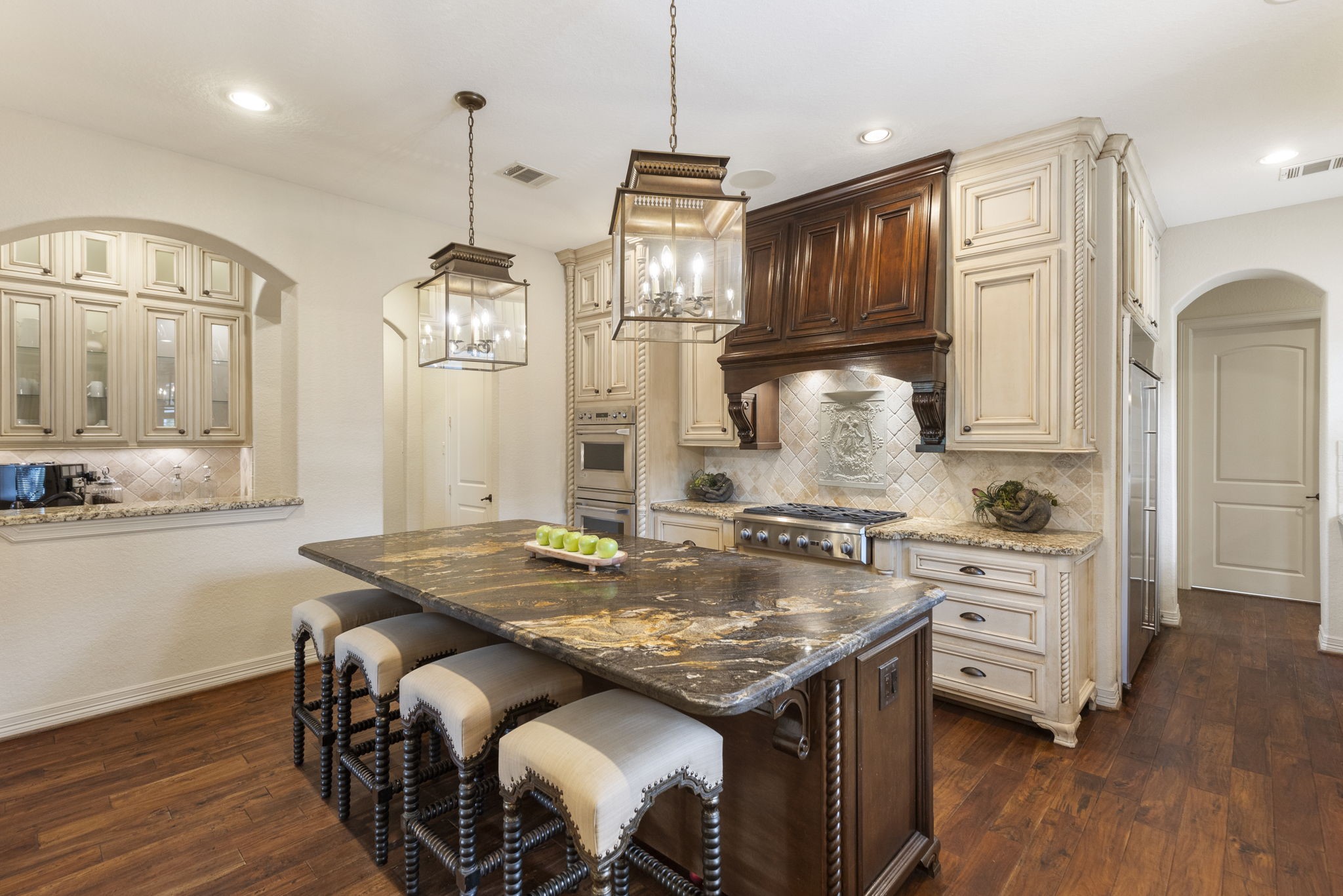 28227 KAILEES Court Spring, TX 77386 - Photo 12 of 48 a kitchen with kitchen island granite countertop wooden floors and stainless steel appliances