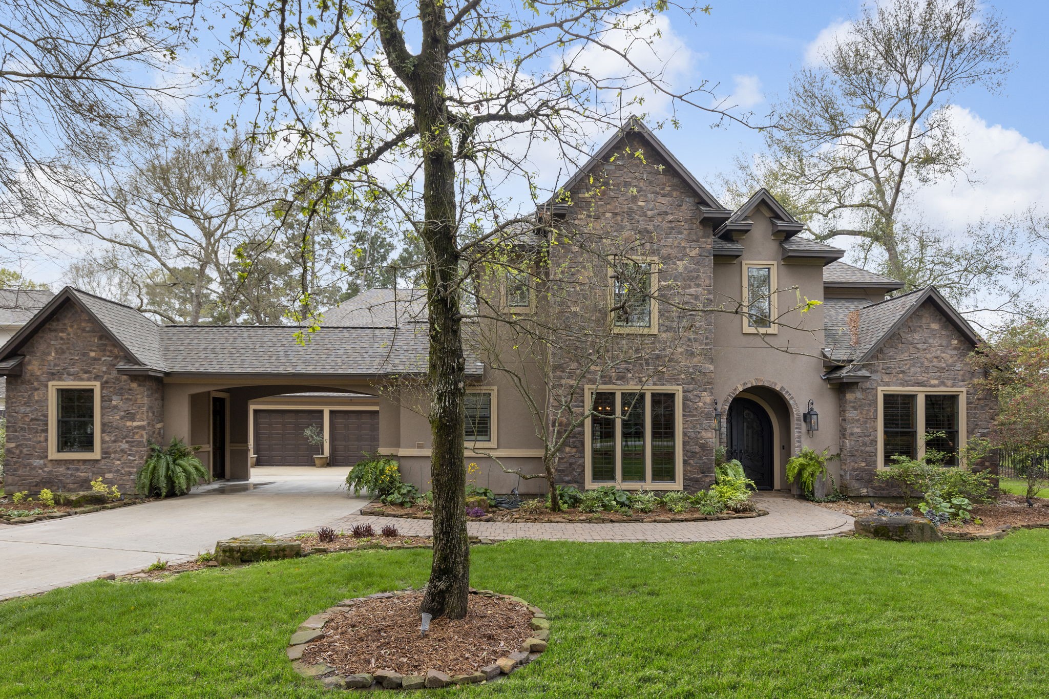 28227 KAILEES Court Spring, TX 77386 - Photo 2 of 48 a front view of a house with a yard and garage