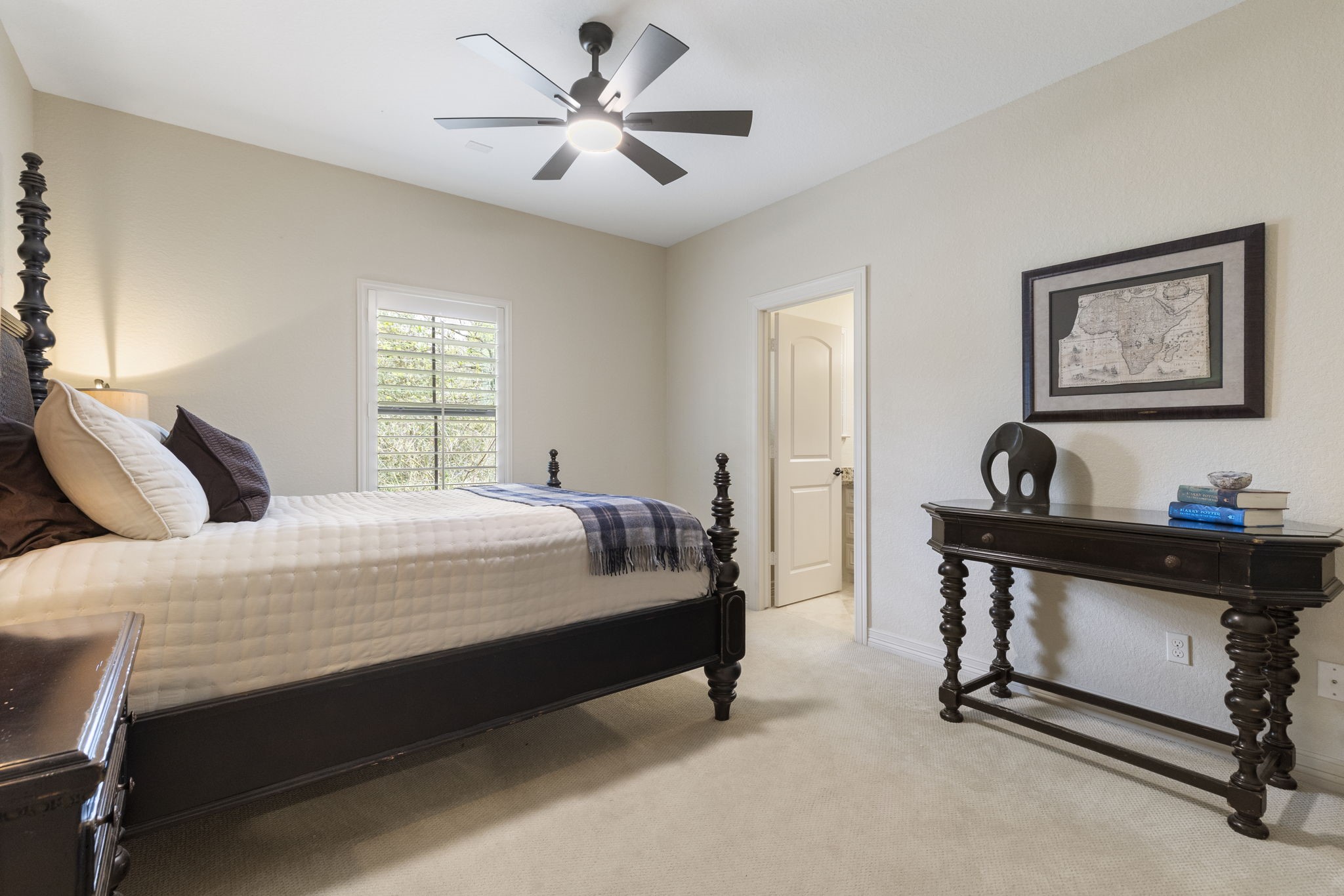28227 KAILEES Court Spring, TX 77386 - Photo 26 of 48 One of three spacious upstairs bedrooms, offering updated carpet, ceiling fan, and a large walk-in closet with custom built-in shelving.