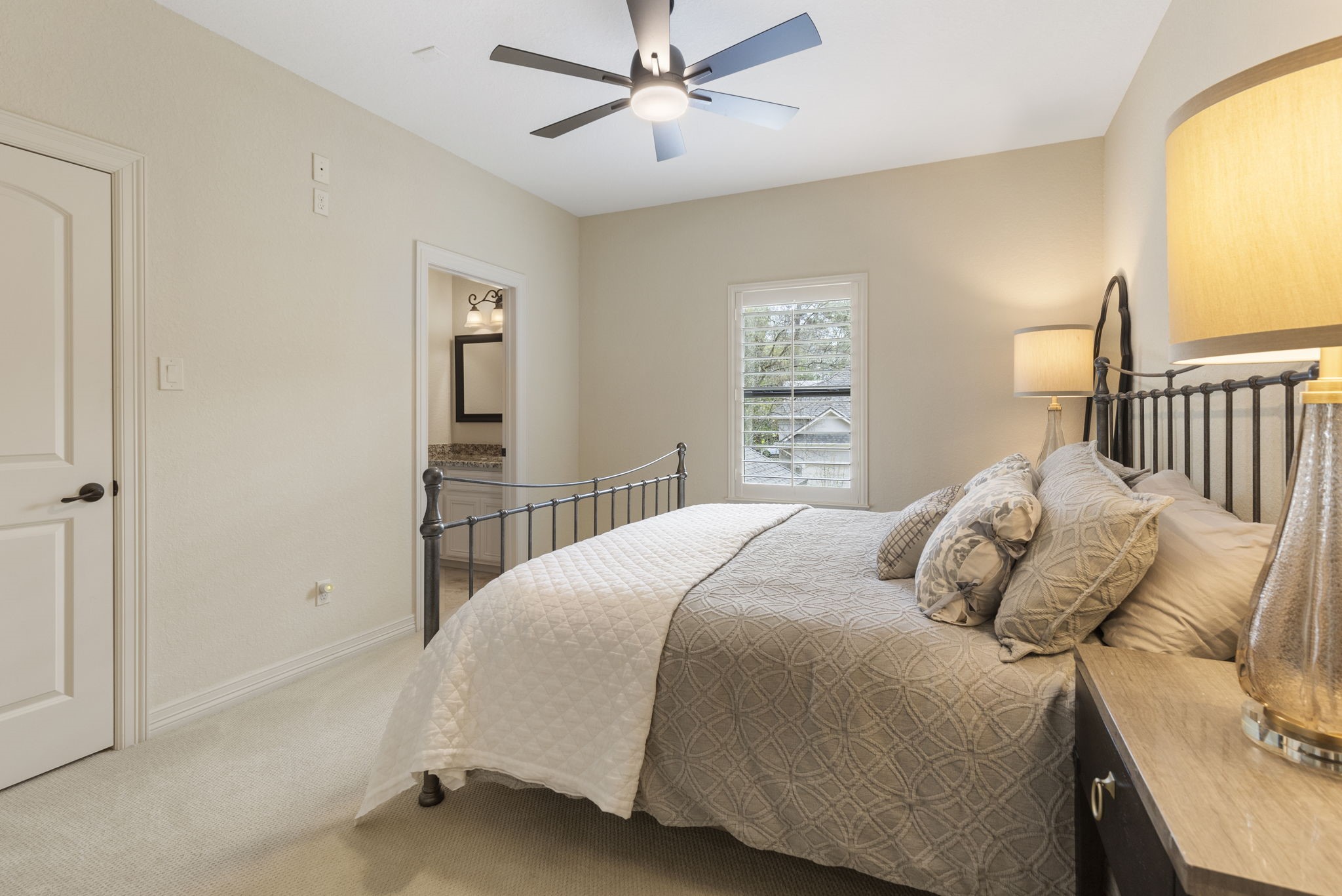 28227 KAILEES Court Spring, TX 77386 - Photo 28 of 48 Spacious upstairs bedroom (14' x 11.5') featuring updated carpet, ceiling fan, and a large walk-in closet with built-in shelving.