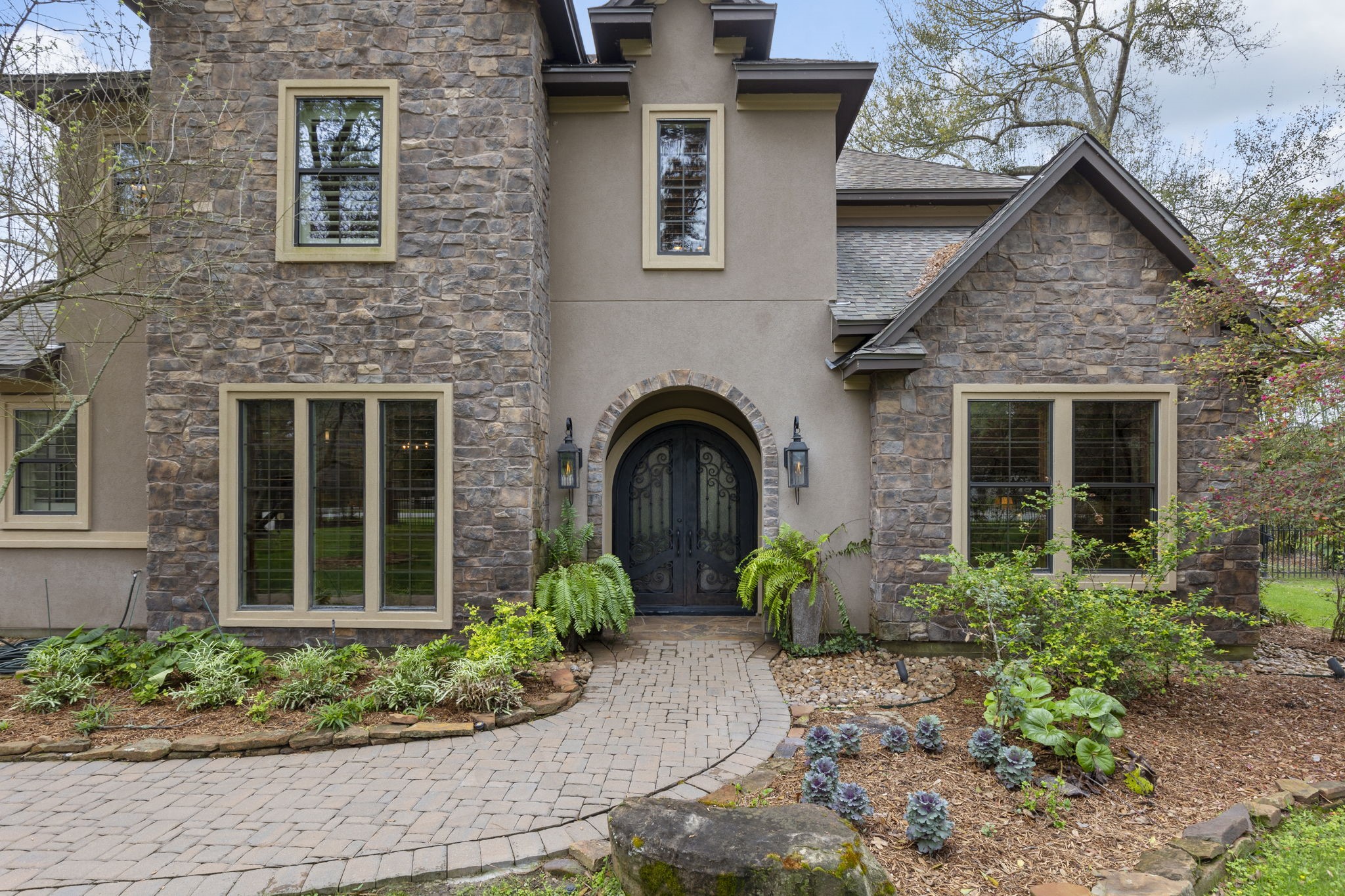 28227 KAILEES Court Spring, TX 77386 - Photo 3 of 48 a front view of a house with garden