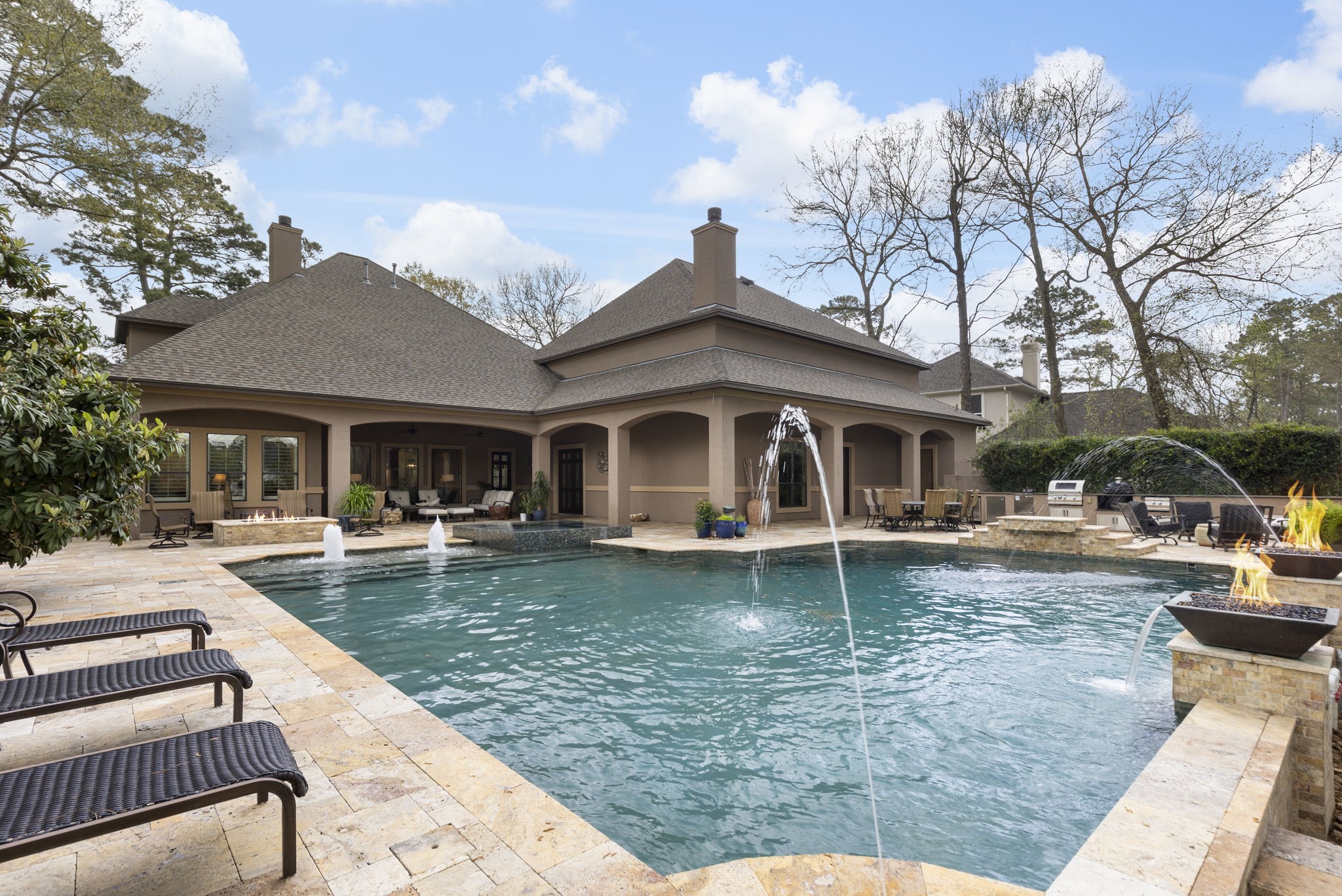 28227 KAILEES Court Spring, TX 77386 - Photo 38 of 48 a front view of a house with swimming pool having outdoor seating