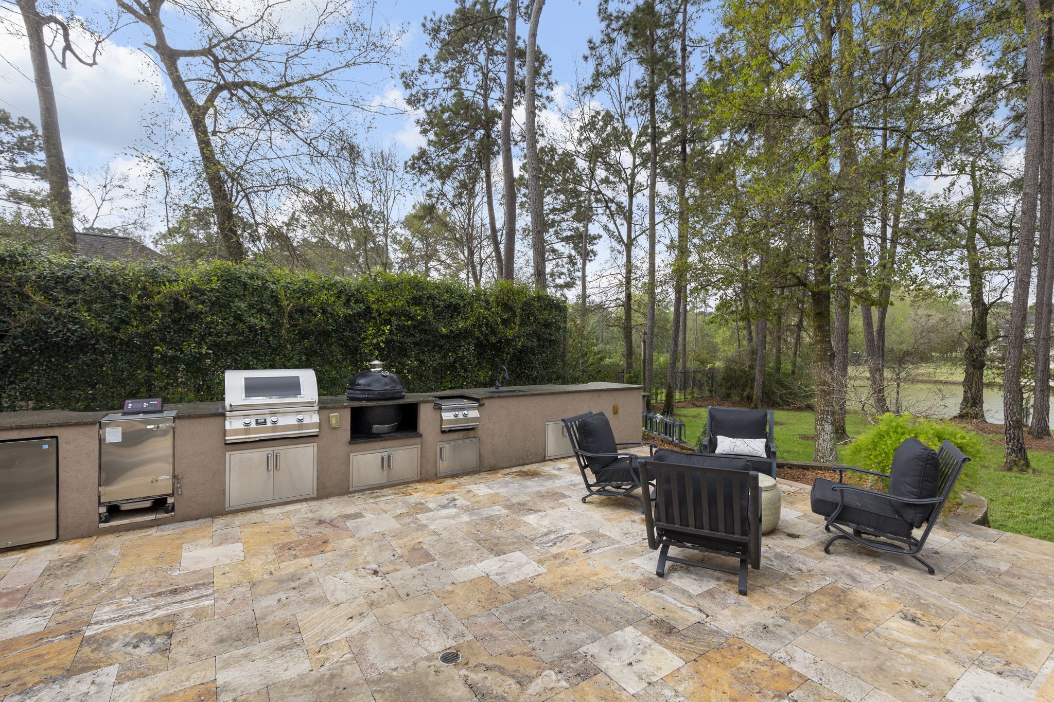 28227 KAILEES Court Spring, TX 77386 - Photo 39 of 48 a backyard of a house with barbeque oven and outdoor seating