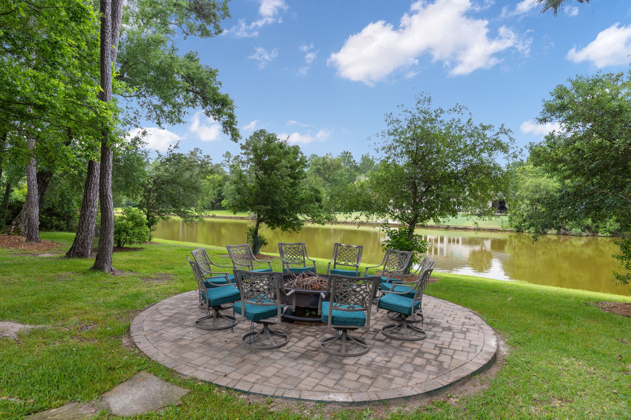 28227 KAILEES Court Spring, TX 77386 - Photo 41 of 48 Beautiful lakeside paver patio, the perfect setting to relax, unwind, and take in breathtaking sunset views over the water.
