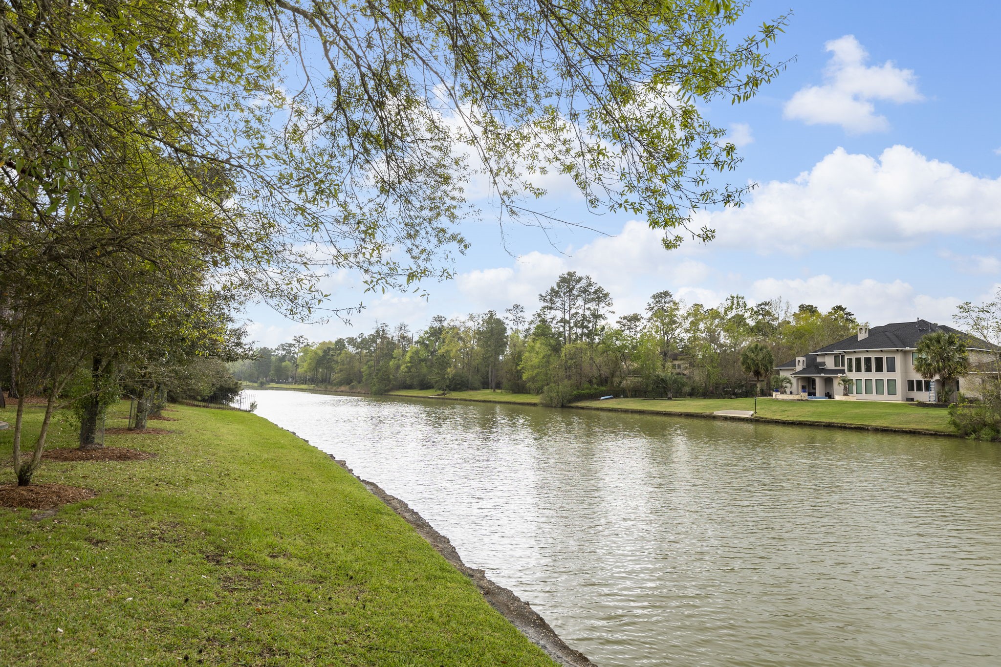 28227 KAILEES Court Spring, TX 77386 - Photo 43 of 48 a view of a lake with houses in the back
